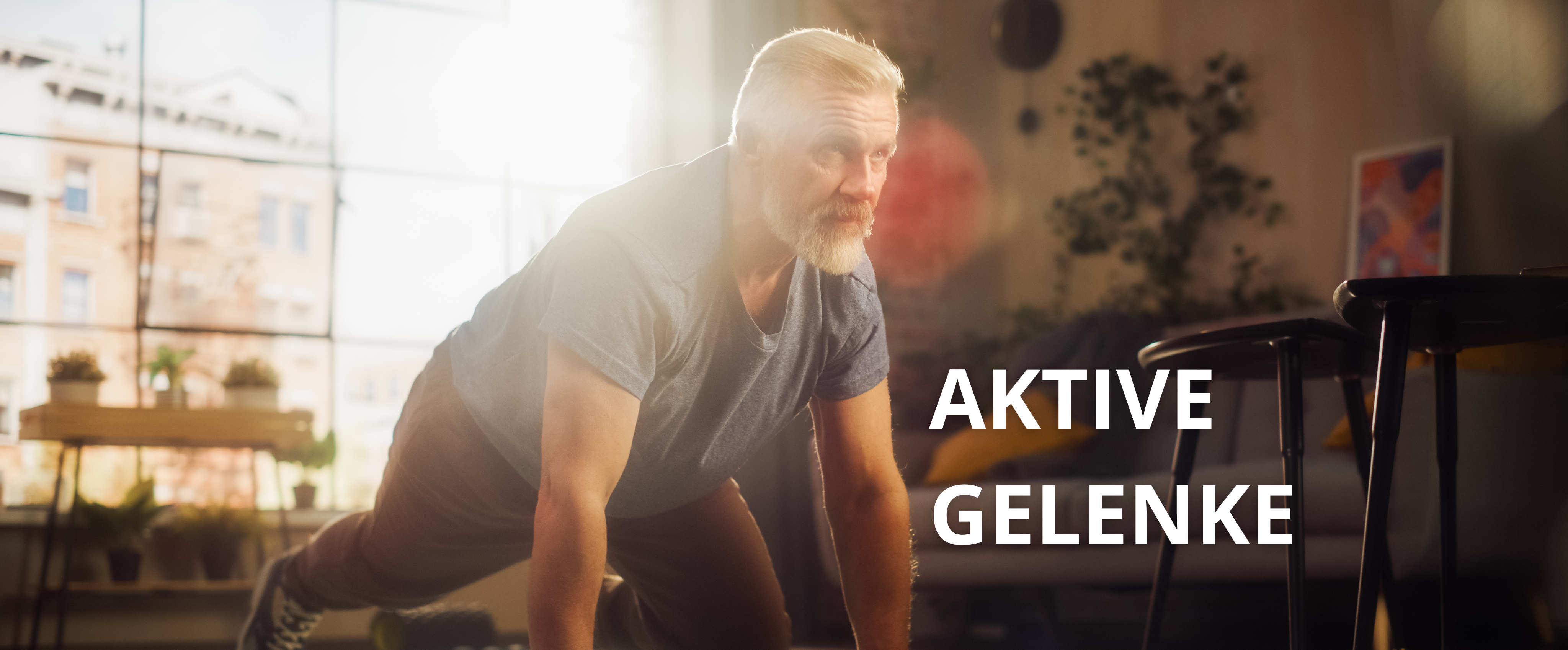 Ein Mann (mittig) macht Liegestütz auf einer grünen Fitnessmatte.